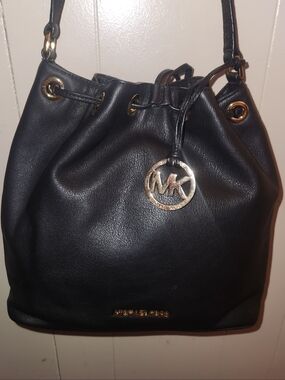 Michael Kors Black Leather Drawstring Hobo with Gold-Tone MK Charm Bucket Bag.